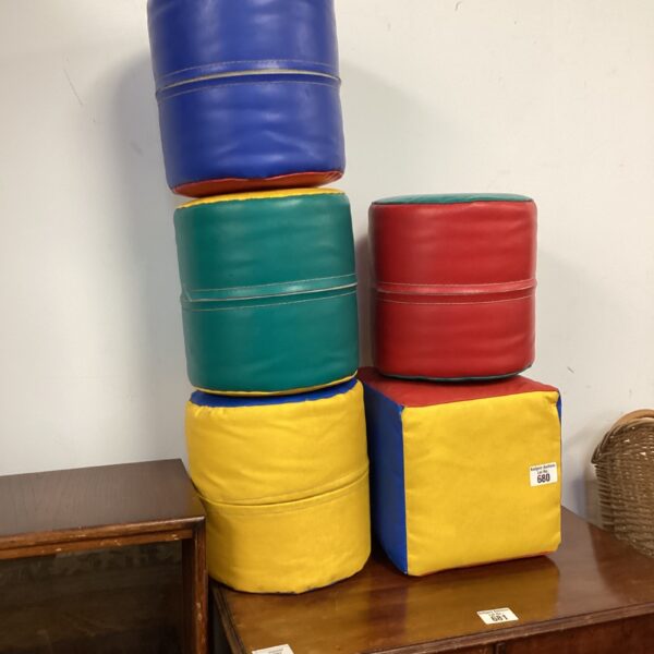 Colourful harlequin leather children's play blocks stacked.