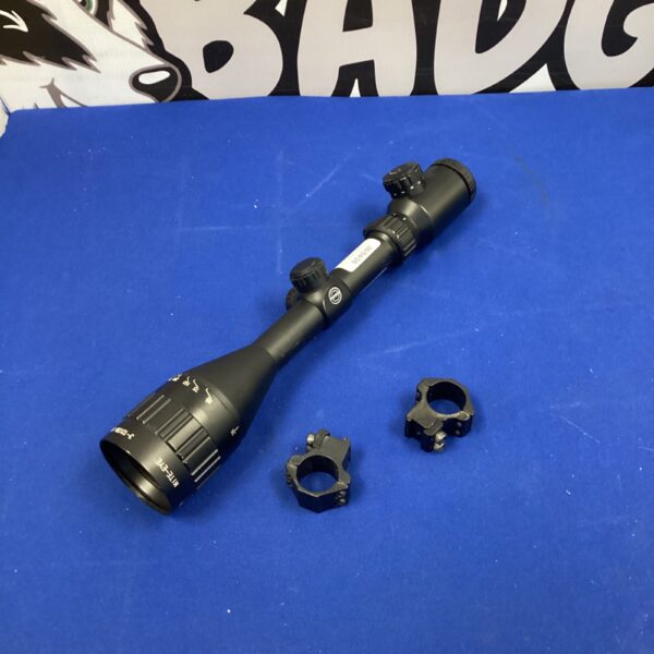 Hawke Nite Eye rifle scope with included mounting hardware.