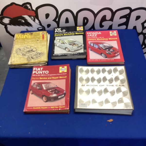 Collection of Haynes manuals including a VW Polo guide.