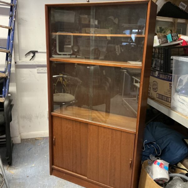 Vintage Herbert E Gibbs teak bookcase with glass front.