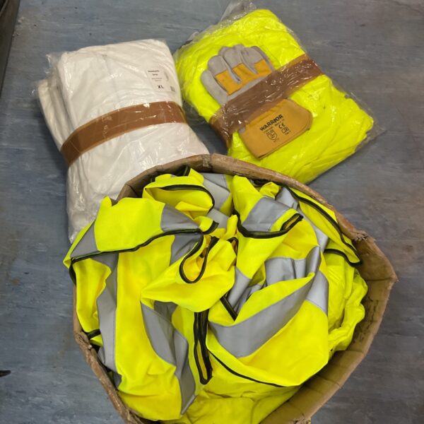 Lot of bright yellow hi vis vests and hazmat suits for safety.