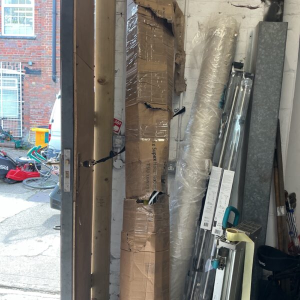 Vintage Hills industrial clothes airer, covered in plastic wrap.