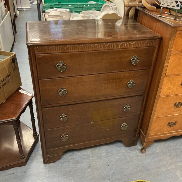 Vintage HL Lebus dresser with four drawers and warm wood finish.