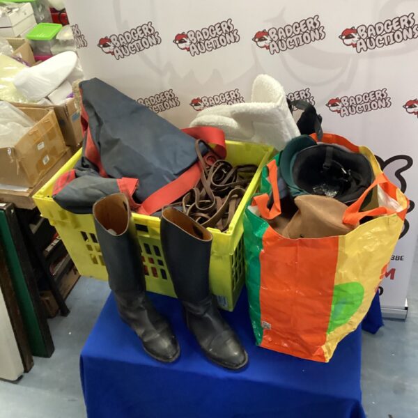 Horse riding equipment lot including hats and helmets.