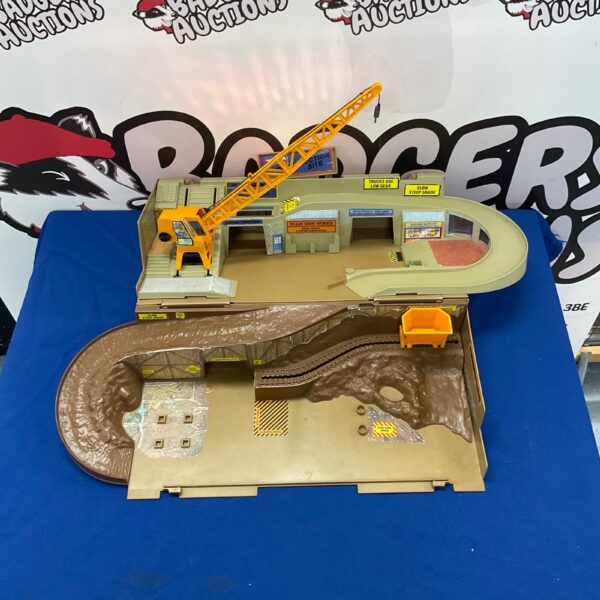 Vintage Hot Wheels construction site track with crane and ramps.