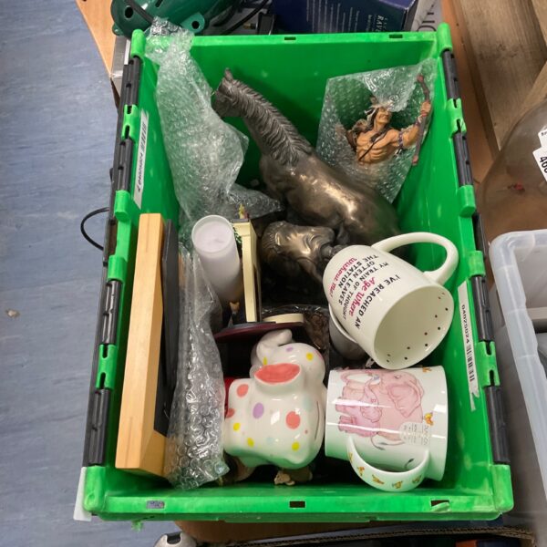 House clearance lot with Native American ornaments and mugs.