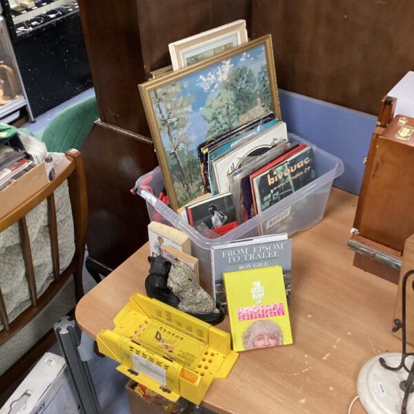 House clearance lot with vinyl records and framed prints.