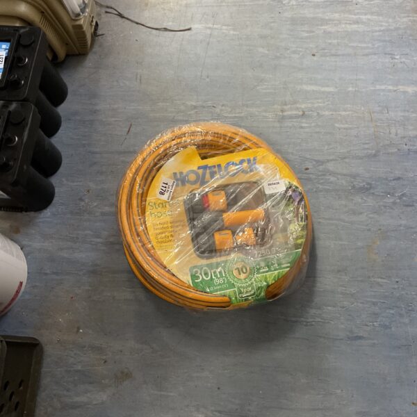 Orange Hozelock Tricoflex hose set for garden watering.