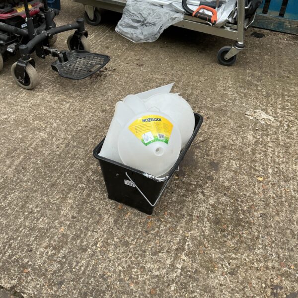 Hozelock weed suppression hood for garden plant protection.