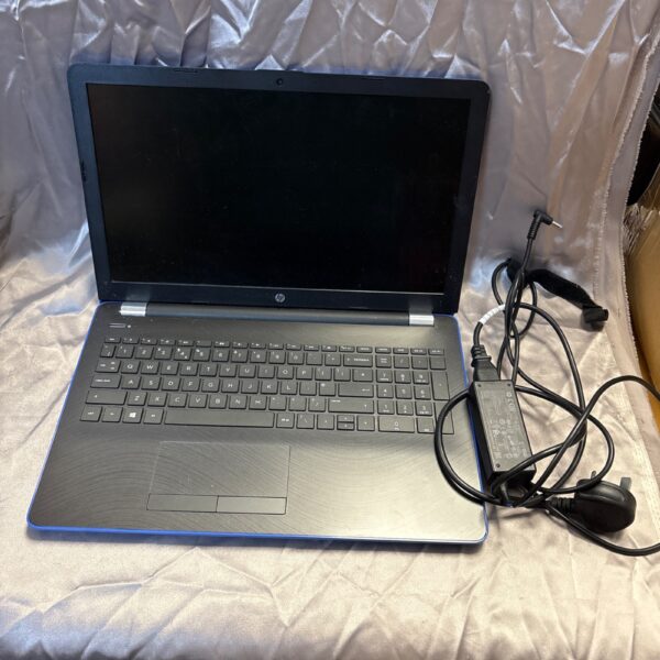 Black HP 15 laptop, model BW099SA, with charger.