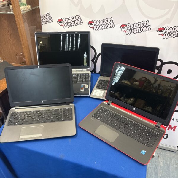 Lot of four HP laptops offered untested for parts or repair.