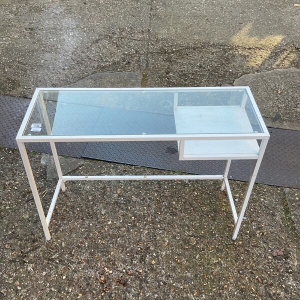 White Ikea laptop table with glass top for home office use.