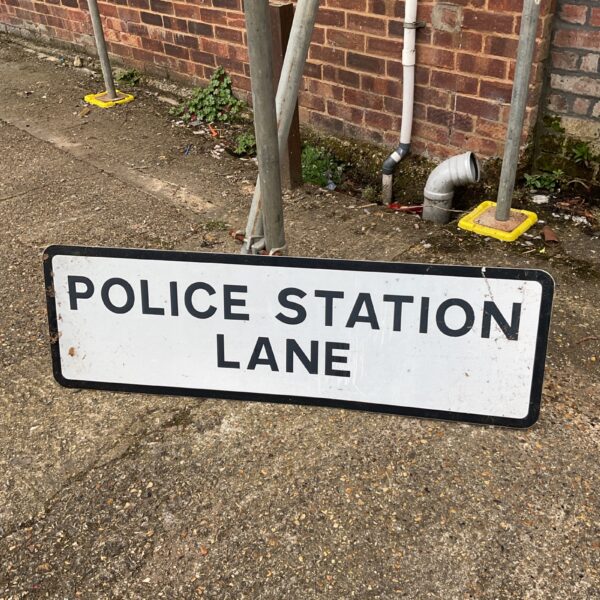 Police station lane road sign