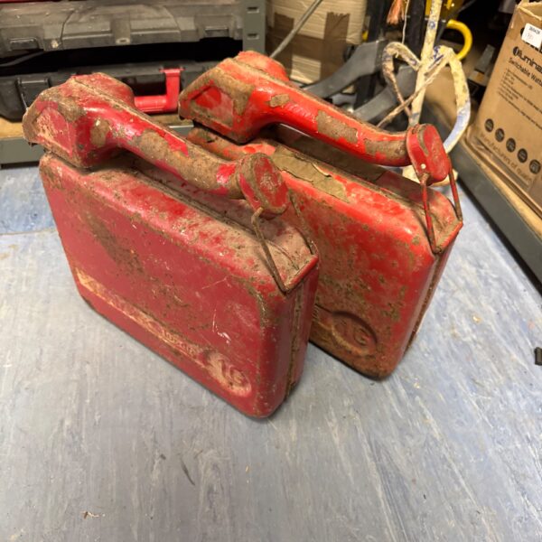 Two Vintage red metal fuel cans