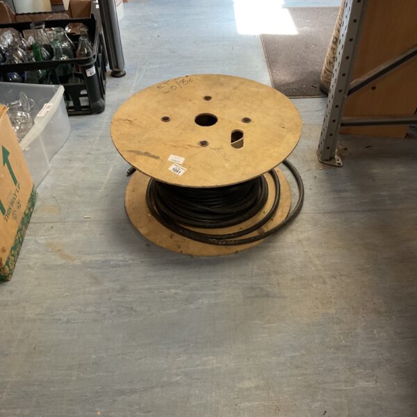 Industrial control cable neatly wound on a wooden drum.