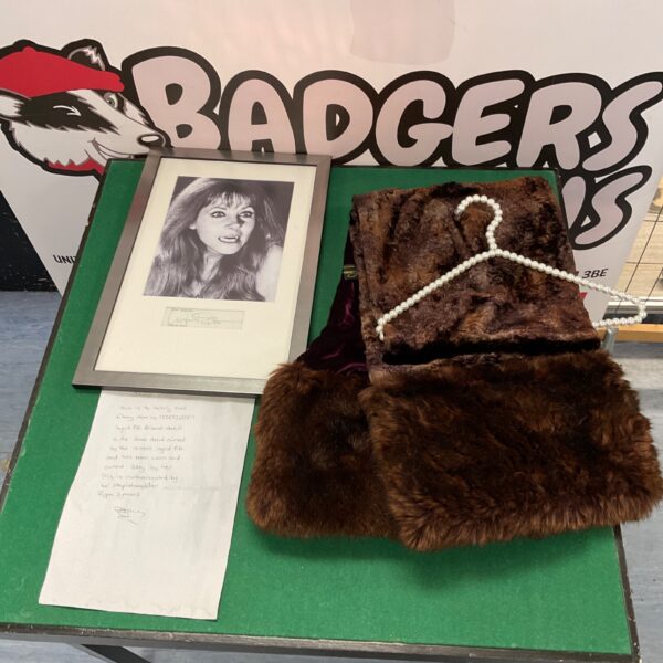 Ingrid Pitt shawl, signed photograph, and authentication letter displayed for auction.