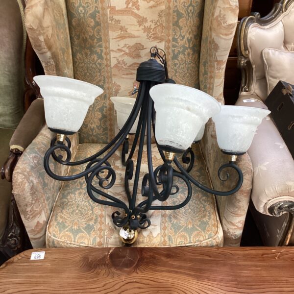 Vintage iron and brass chandelier with frosted glass shades.