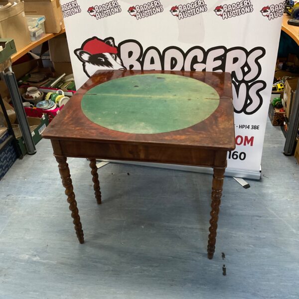 Antique Jacobean mahogany card table with carved spiral legs.