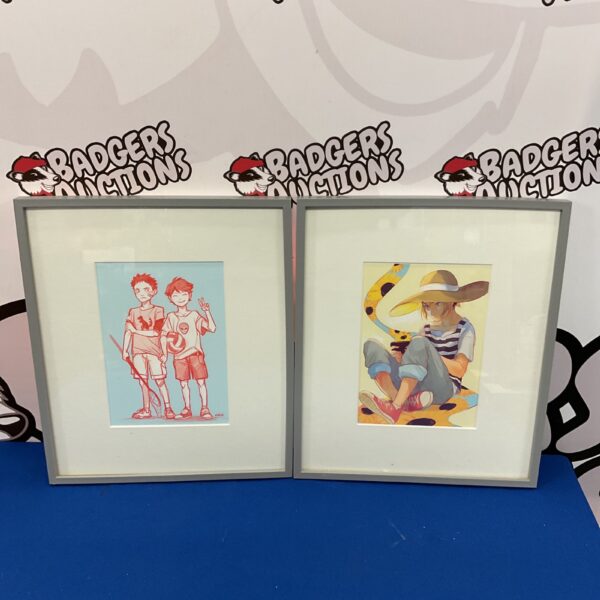 Pair of framed Japanese anime prints with colourful characters.