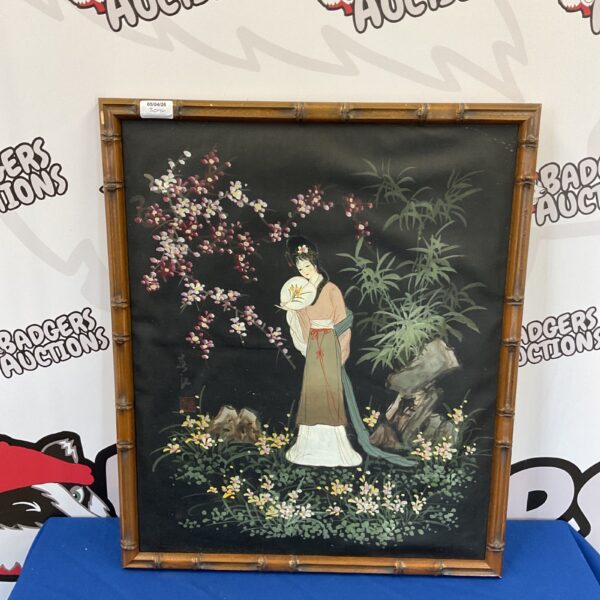 Vintage Japanese oil painting of a geisha in a bamboo frame.