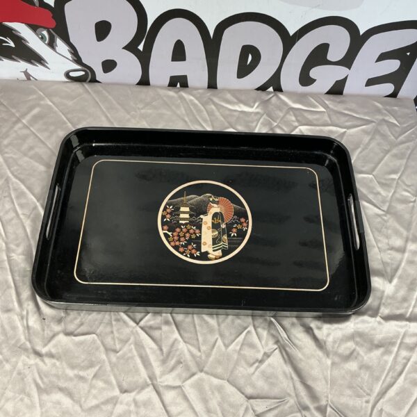 Vintage Japanese lacquered tray with detailed Asian design.