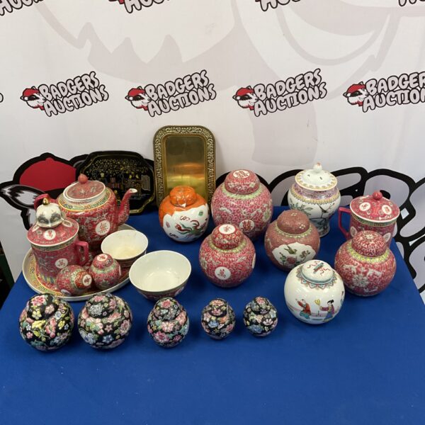 Antique Japanese porcelain ginger jars and teaset collection on display.