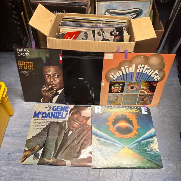 Vintage jazz LP collection featuring Miles Davis records.