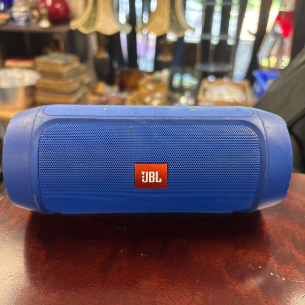 Blue JBL Charge 2+ Bluetooth speaker, portable wireless audio device.