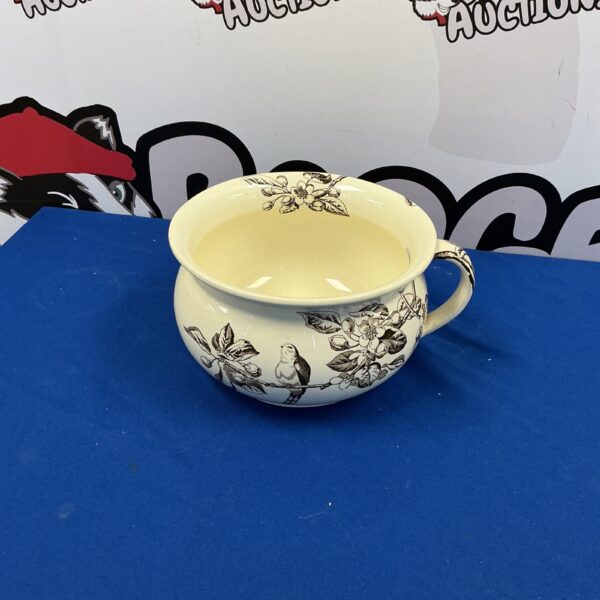 Antique J C and Sons Tom Tit porcelain chamber pot with floral design.