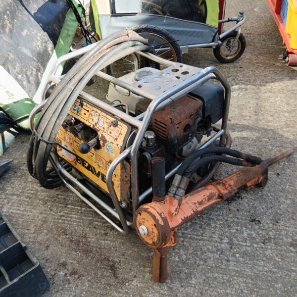 Side view of a used JCB Beaver hydraulic breaker.