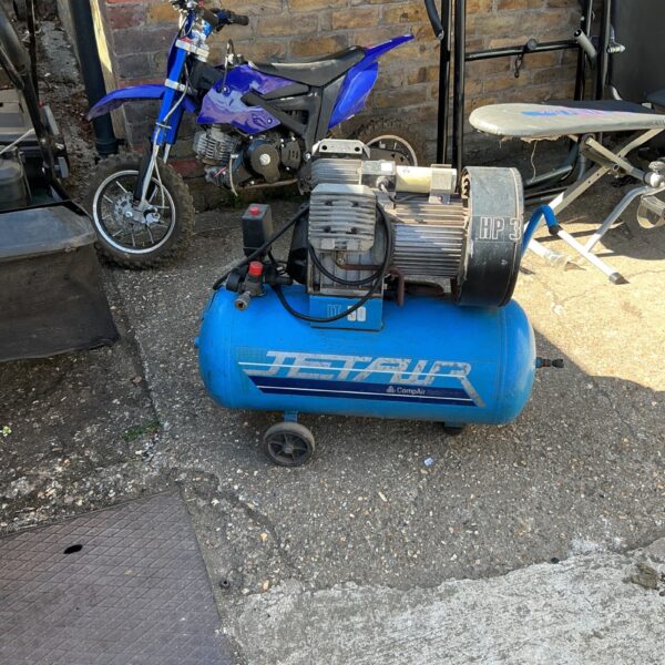 Portable Jet air compressor in a workshop setting.