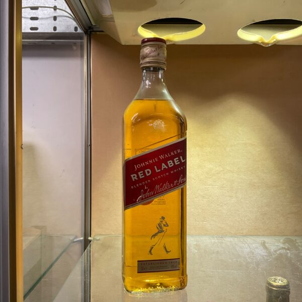Johnnie Walker Red Label whiskey bottle, classic blended scotch.