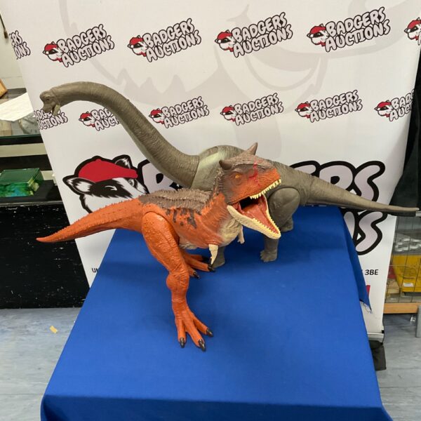Large Jurassic Park T-Rex and Brontosaurus toy figures for collectors.