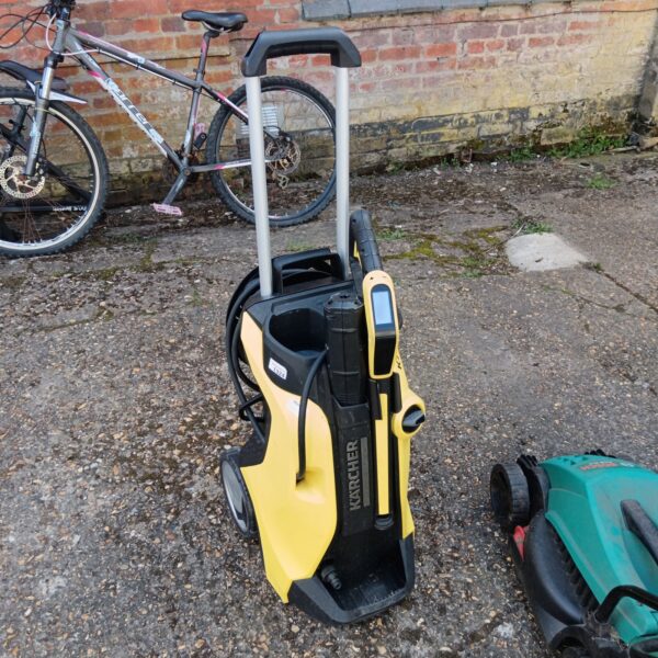 Karcher K7 pressure washer in a garden setting.
