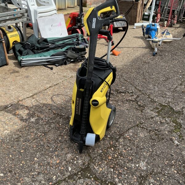Front view of a used Karcher power washer for garden cleaning.