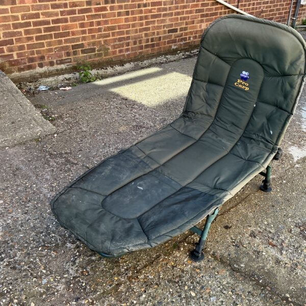 Kennets Pro Carp fishing bed chair in outdoor setting.