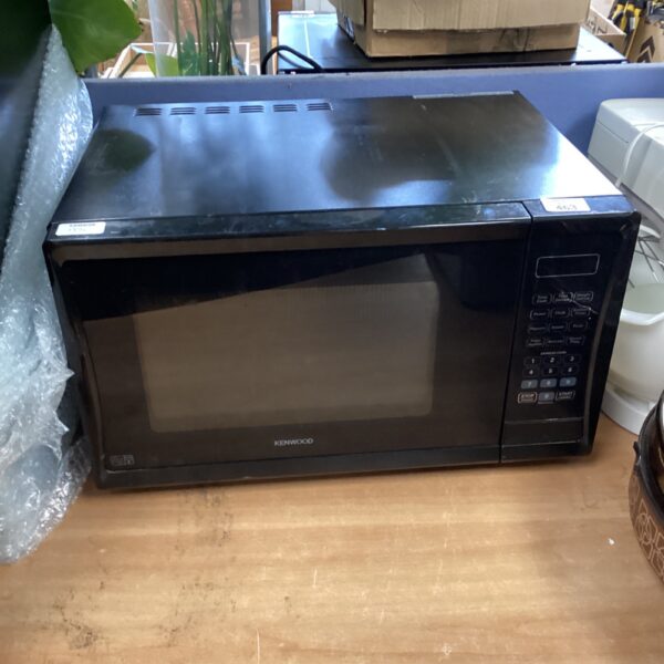 Black Kenwood microwave oven, vintage kitchen appliance.