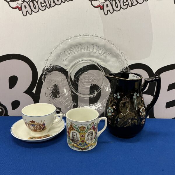 Antique King George & Queen Victoria commemorative china set on display.
