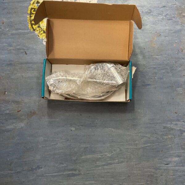 Polished chrome kitchen mixer tap in original packaging.
