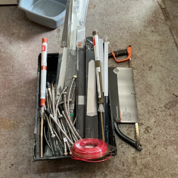 Assortment of stainless steel kitchen tap connector pipes and fittings.