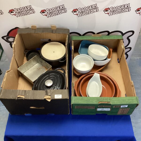 Stoneware kitchenware set including casserole dishes and serving pieces.