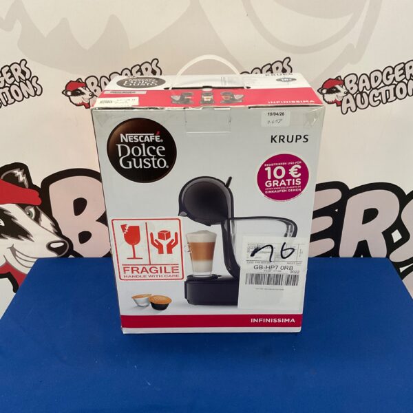 Red Krups Dolce Gusto Infinissima coffee machine in original packaging.