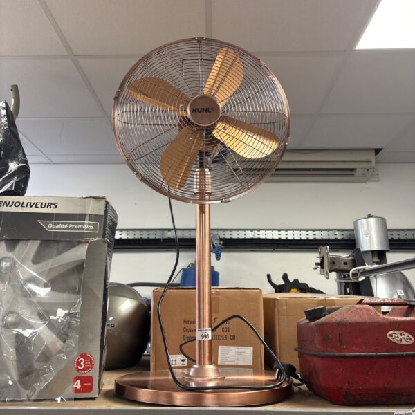 Vintage KUHL metal pedestal fan in a retro style.