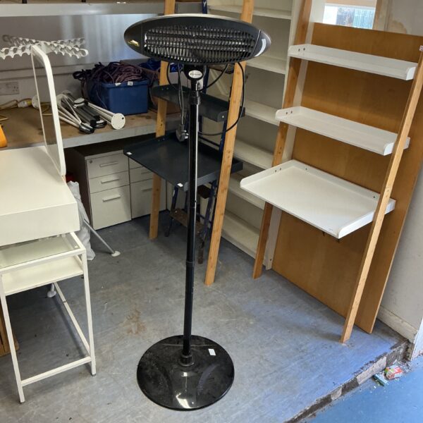 Black La Hacienda halogen patio heater with weighted base.
