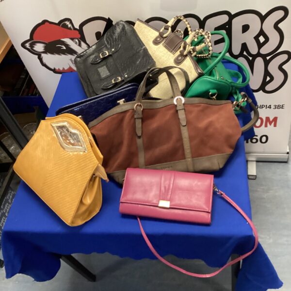 Mixed lot of ladies handbags in various colours and styles.