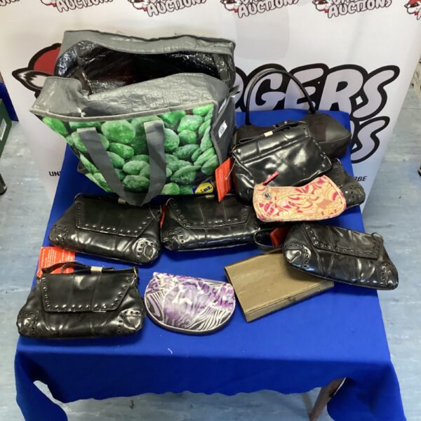 Mixed lot of ladies handbags in various colours and styles.