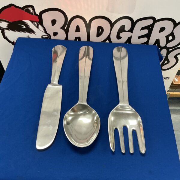 Large wall hanging cutlery set, featuring a knife, fork, and spoon.