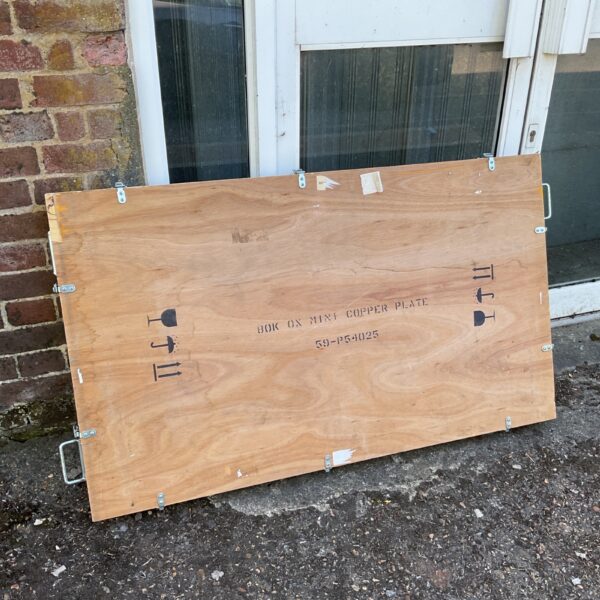 Large wooden transit case with locking catches, ideal for storage.