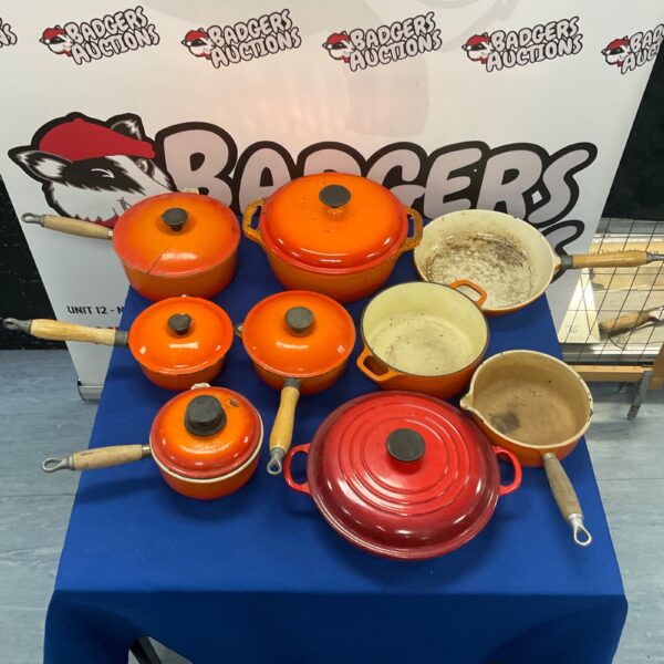 Vibrant Le Creuset cast iron cookware collection with colourful pots and pans.
