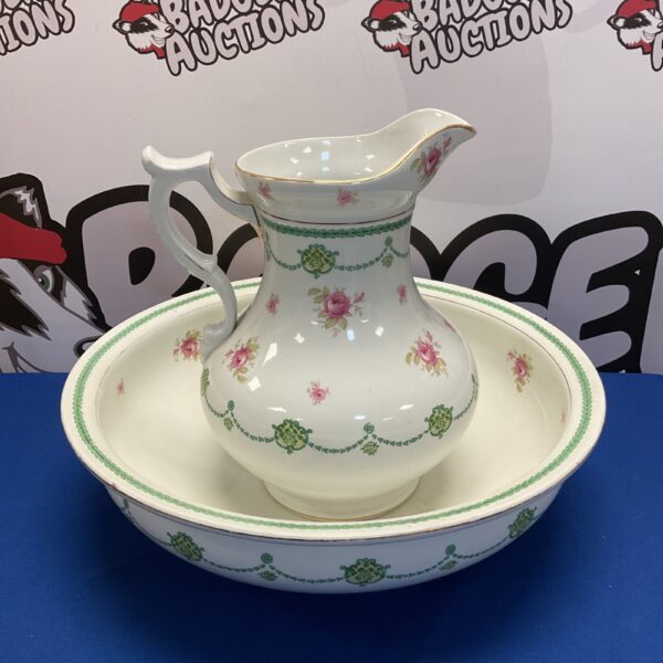 Antique Ledbury porcelain wash bowl and jug with floral design.